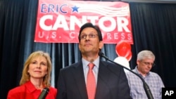 House Majority Leader Eric Cantor, R-Va., delivers his concession speech as his wife, Diana, listens in Richmond, Va., June 10, 2014. Cantor lost in the GOP primary tp tea party candidate Dave Brat. 