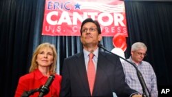 House Majority Leader Eric Cantor, R-Va., delivers his concession speech as his wife, Diana, listens in Richmond, Va., June 10, 2014. Cantor lost in the GOP primary tp tea party candidate Dave Brat. 