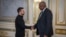 U.S. Secretary of Defense Lloyd Austin, right, and Ukraine's President Volodymyr Zelenskyy shake hands during their meeting in Kyiv, Ukraine, Oct. 21, 2024. (Press Service of the President of Ukraine via AP)