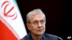FILE - Iran's government spokesman Ali Rabiei speaks during a press briefing in Tehran, Iran, July 7, 2019. 