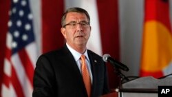 FILE - Defense Secretary Ash Carter speaks during a change of command ceremony at Peterson Air Force Base, in Colorado Springs, Colorado, May 13, 2016. Carter says says military spending legislation in Congress "undercuts stable planning and efficient use