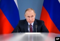 FILE - Russian President Vladimir Putin attends a meeting during a visit to Samara, Russia, March 7, 2018. Tense relations with Russia are among the challenges nominee Mike Pompeo will face if confirmed as the next U.S. secretary of state.
