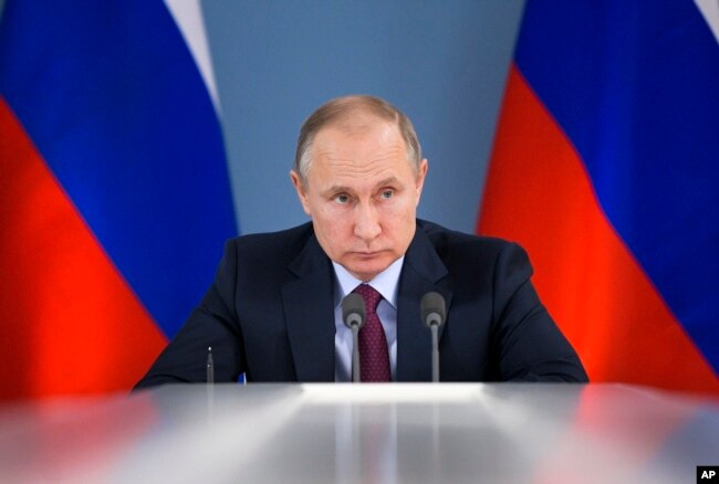 Russian President Vladimir Putin attends a meeting during his visit to Samara, Russia, March 7, 2018. Putin had more words of praise for U.S. President Donald Trump in a documentary released March 7.