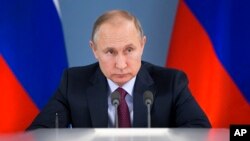 Russian President Vladimir Putin attends a meeting during his visit to Samara, Russia, March 7, 2018. Putin had more words of praise for U.S. President Donald Trump in a documentary released March 7 but expressed disappointment with the U.S. political system. 