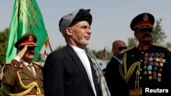 FILE - Afghan President Ashraf Ghani attends Afghan Independence Day celebrations in Kabul, Afghanistan, Aug. 19, 2017. 