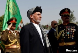 FILE - Afghan President Ashraf Ghani attends Afghan Independence Day celebrations in Kabul, Afghanistan, Aug. 19, 2017.