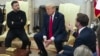 Vice President JD Vance, right, speaks with Ukrainian President Volodymyr Zelenskyy, left, as President Donald Trump listens in the Oval Office at the White House in Washington, Feb. 28, 2025.