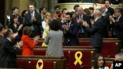 Deputy Roger Torrent (C) is congratulated after being elected as the new president of the Catalan parliament after a parliamentary session where elected lawmakers meet for the first time after regional elections in Catalonia, Barcelona, Spain, Jan. 1