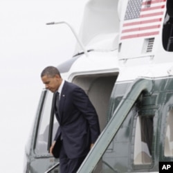 President Obama steps off of Marine One at Dover Air Force Base, Del., Aug. 9, 2011.