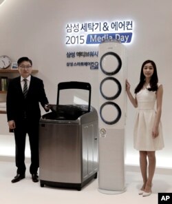 FILE - A Samsung washing machine and air conditioner are displayed during a media day for unveiling new consumer electronics products in Seoul, South Korea, Feb. 3, 2015.