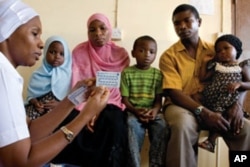 A family receives family planning advice at Kivunge Hospital, Zanzibar