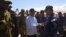 Leslie Voltaire, president of Haiti's transition council, welcomes a military contingent from El Salvador, at the Toussaint Louverture International Airport, in Port-au-Prince, Haiti, Feb. 4, 2025.