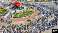 Protesters take part in a demonstration against the military coup in Naypyidaw on February 22, 2021. (Photo by STR / AFP)