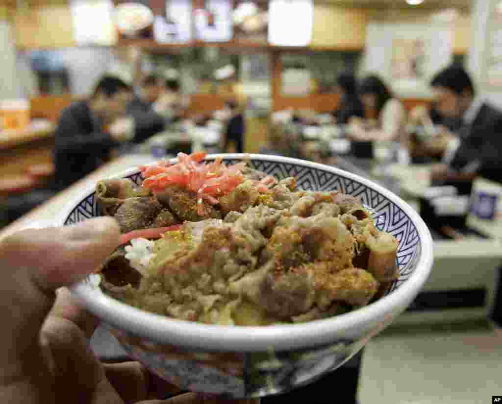 "Gyudon," or a rice dish topped with American beef, is shown at a restaurant of Japanese fast-food chain Yoshinoya D&C Co. in Tokyo, Thursday, April 24. 2008.