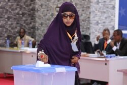 A member of parliament of Somaliaís Jubaland state casts her vote during the presidential election held in Kismayo, on Aug. 22, 2019.