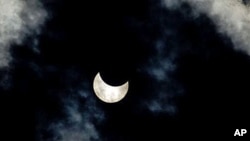 A view of a partial solar eclipse as seen from the town of Givatayim near Tel Aviv, Israel. A partial solar eclipse began Tuesday in the skies over the Mideast and will extend across much of Europe, 4 Jan 2011