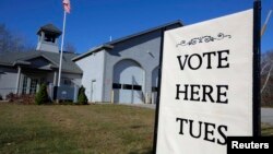 A sign marks the polling place for voters in Kennebunkport, Maine, Nov. 3, 2014. 