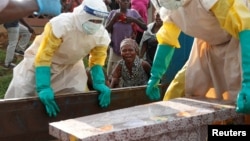 FILE - A mother of a child, suspected of dying from Ebola, cries near her child's coffin in Beni, North Kivu Province of Democratic Republic of Congo, Dec.17, 2018