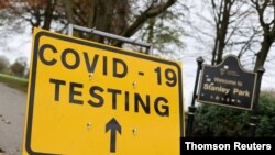 FILE - A sign is seen at the coronavirus disease (COVID-19) test centre at Stanley Park, near Anfield, on the first day of a newly imposed lockdown, in Liverpool, Britain, November 5, 2020.