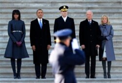 FILE - Dr. Jill Biden, right, stands with first lady Michelle Obama, left, newly inaugurated President Barack Obama, second left, and Vice President Joe Biden, second right, at the Capitol in Washington, Jan. 21, 2013.