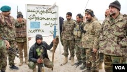 Afghan security forces posing to camera in front of a so-called Afghanistan Islamic Emirates custom house sign the reads “Do no pass without custom house tariff. Jan. 13. 2020. (Photo courtesy of Afghan Ministry of Defense)