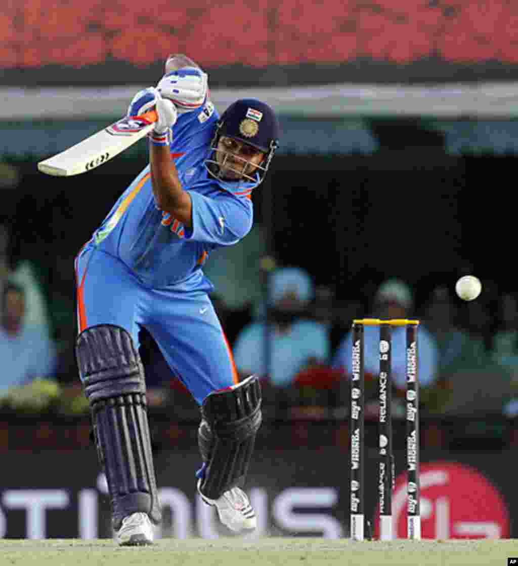 India's Suresh Raina plays a shot during the semi-final match against Pakistan in Mohali, March 30, 2011.