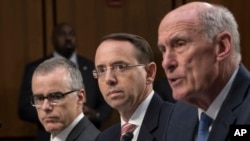 From left, acting FBI Director Andrew McCabe, Deputy Attorney General Rod Rosenstein, and From left, acting FBI Director Andrew McCabe, Deputy Attorney General Rod Rosenstein, and Director of National Intelligence Dan Coats, testify before a Senate Intelligence Committee hearing about the Foreign Intelligence Surveillance Act, on Capitol Hill, June 7, 2017, in Washington. 