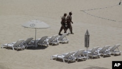 Mexican soldiers patrol the beach of San Jose del Cabo in Mexico's Baja Peninsula, Sunday, June 17, 2012. The G-20 summit starts in Los Cabos on Monday.