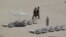 Mexican soldiers patrol the beach of San Jose del Cabo in Mexico's Baja Peninsula, Sunday, June 17, 2012. The G-20 summit starts in Los Cabos on Monday.