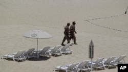 Mexican soldiers patrol the beach of San Jose del Cabo in Mexico's Baja Peninsula, Sunday, June 17, 2012. The G-20 summit starts in Los Cabos on Monday.