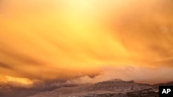 A view is seen of a cloud of ash from Chile's Puyehue-Cordon Caulle volcano chain near sunset at the mountain resort San Martin de Los Andes in Argentina's Patagonia June 12, 2011.