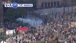 Tear gas rises as protesters clash with riot police near Cairo's Tahrir Square.