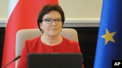 Polish Prime Minister Ewa Kopacz opens a meeting of her cabinet in Warsaw, Poland, October 20, 2015.