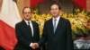 FILE - French President Francois Hollande (L) and his Vietnamese counterpart Tran Dai Quang shake hands at the Presidential Palace in Hanoi, Vietnam, Sept. 6, 2016.