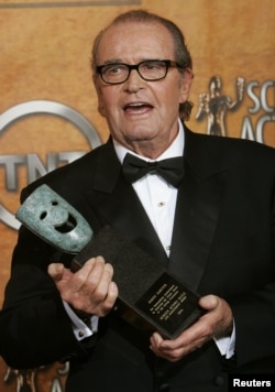 James Garner smiles with his award at the 11th annual Screen Actors Guild awards at the Shrine Auditorium in Los Angeles, Feb. 5, 2005.