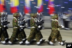 FILE - Myanmar military officers march during a parade to commemorate Myanmar's 79th Armed Forces Day, in Naypyitaw, Myanmar, March 27, 2024.