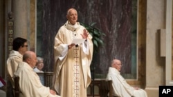 Cardinal Donald Wuerl, Archbishop of Washington, speaks before Mass at St. Mathews Cathedral, Aug. 15, 2018, in Washington. A Pennsylvania state grand jury report that was released Tuesday accused senior church officials, including Wuerl, of systematically covering up complaints. 