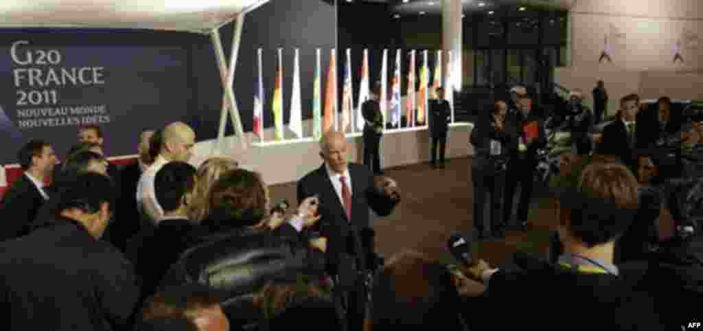 Greek Prime Minister George Papandreou speaks with the media outside of a G20 summit in Cannes, France on Wednesday, Nov. 2, 2011. Greek Prime Minister George Papandreou was flew to the chic French Riviera resort of Cannes on Wednesday to explain himself 