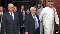A handout photograph from Syria's national news agency shows Syria's delegation headed by FM Walid Moualem (C), Bouthaina Shaaban (behind Moualem), a political advisor to President Bashar al-Assad, and ambassador to the Arab League Yousef al-Ahmed (L) aft