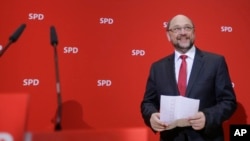 Social Democratic Party, SPD, chairman and top candidate in the upcoming general elections Martin Schulz arrives for a statement after first projections of the state election in German state Saarland announced at the party's headquarters in Berlin, Sunday, March 26, 2017. 
