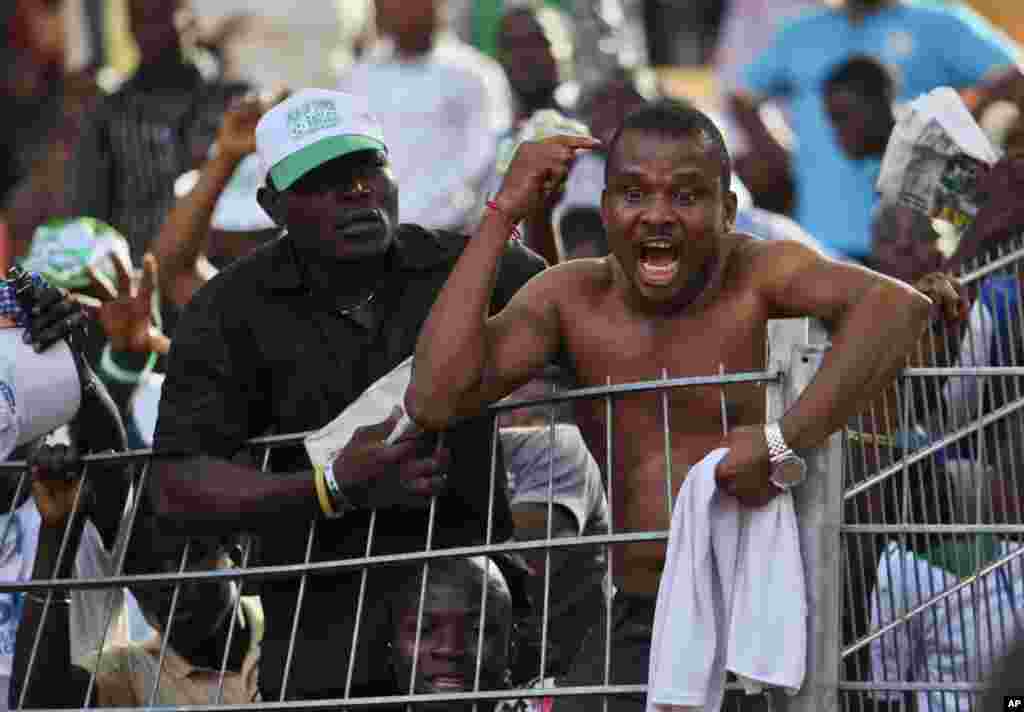 A Nigeria fan reacts during the team's African Nations Cup qualifying soccer match against Guinea in Abuja October 8, 2011. Nigeria and South Africa were among the heavyweight casualties on the penultimate day of African Nations Cup qualifying as Angola, 