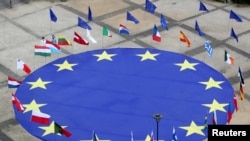 European Union flag lies at the centre of Schuman Square outside European Commission headquarters in Brussels, Belgium, May 8, 2021. 
