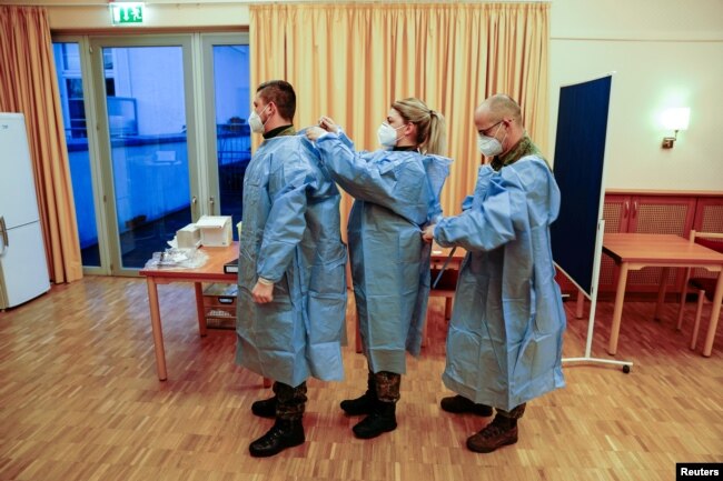 The German armed forces Bundeswehr vaccination team prepares for the Pfizer/BioNTech COVID-19 vaccinations at the Agaplesion Bethanien Sophienhaus nursing home in Berlin, Germany December 27, 2020, the day when the country starts its vaccination program.