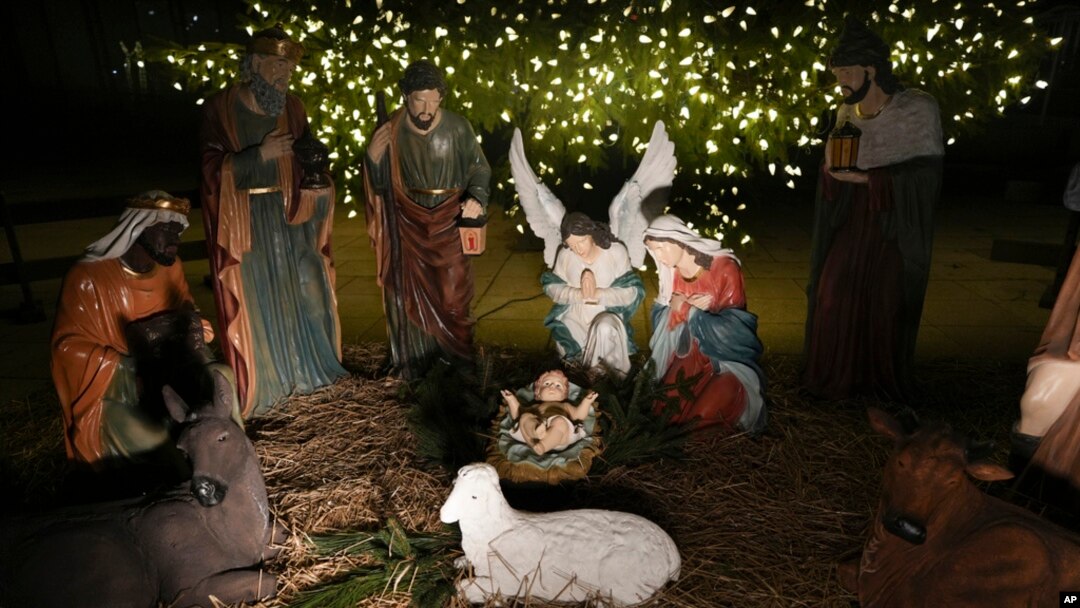 A Nativity scene is illuminated by a Christmas tree on Payrow Plaza in Bethlehem, Pennsylvania, known as 'Christmas City, USA,' Dec. 1, 2024.