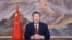 In this photo released by Xinhua News Agency, Chinese President Xi Jinping delivers a New Year message on Dec. 31, 2024 in Beijing to ring in 2025. (Ju Peng/Xinhua via AP)