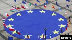 European Union flag lies at the centre of Schuman Square outside European Commission headquarters in Brussels, Belgium, May 8, 2021. 