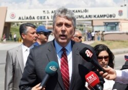 FILE - Philip Kosnett, then the U.S. charge d'affaires in Turkey, talks to reporters in Izmir, July 18, 2018.
