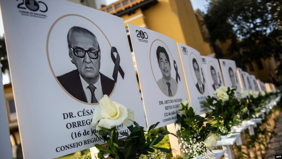 Images of the 125 doctors who have died during the COVID-19 pandemic in Peru, are displayed outside Peru's Medical College (CMP) in Lima on Aug. 13, 2020. 