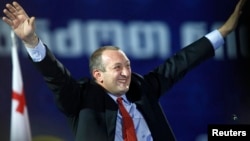Georgy Margvelashvili waves to supporters during a presentation of his election programme in Tbilisi, September 19, 2013.