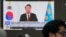 A TV screen shows a file image of South Korean President Yoon Suk Yeol being broadcast at the KEB Hana Bank headquarters in Seoul, South Korea, Dec. 26, 2024.